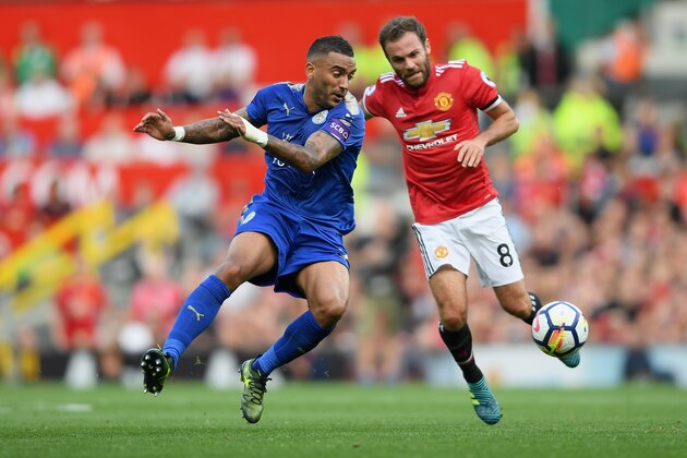MANCHESTER, ENGLAND - AUGUST 26: Danny Simpson of Leiceter City and Juan Mata of Manchester United battle for possession during the Premier League match between Manchester United and Leicester City at Old Trafford on August 26, 2017 in Manchester, England.  (Photo by Ross Kinnaird/Getty Images)