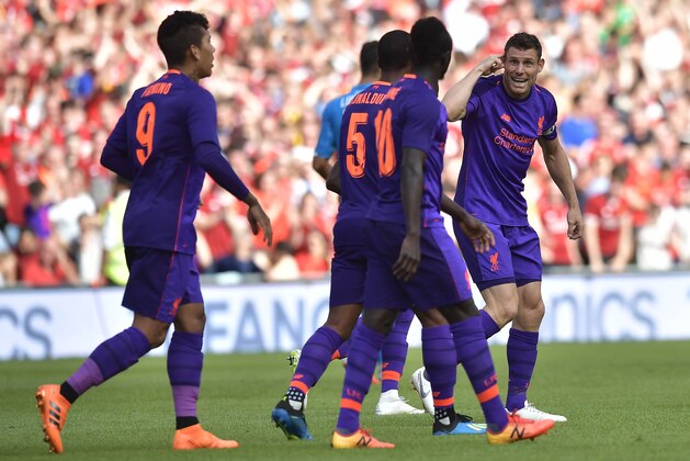 DUBLIN, IRELAND - AUGUST 04: James Milner of Liverpool celebrates after scoring during the international friendly game between Liverpool and Napoli at Aviva Stadium on August 4, 2018 in Dublin, Ireland. (Photo by Charles McQuillan/Getty Images)