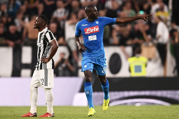 Napoli's French defender Kalidou Koulibaly (R) celebrates after scoring a goal during the Italian Serie A football match between Juventus and Napoli on April 22, 2018 at the Allianz Stadium in Turin. (Photo by MARCO BERTORELLO / AFP)        (Photo credit should read MARCO BERTORELLO/AFP/Getty Images)