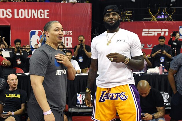 LAS VEGAS, NV - JULY 15:  Head coach Tyronn Lue (L) of the Cleveland Cavaliers talks with LeBron James of the Los Angeles Lakers after a quarterfinal game of the 2018 NBA Summer League between the Lakers and the Detroit Pistons at the Thomas & Mack Center on July 15, 2018 in Las Vegas, Nevada. NOTE TO USER: User expressly acknowledges and agrees that, by downloading and or using this photograph, User is consenting to the terms and conditions of the Getty Images License Agreement.  (Photo by Ethan Miller/Getty Images)