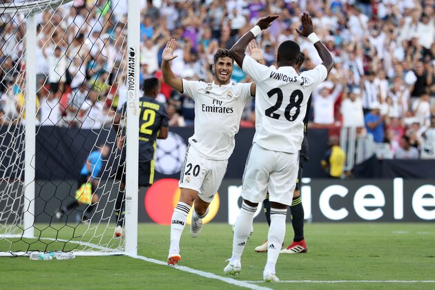 LANDOVER, MD - AUGUST 04: Marco Asensio #20 of Real Madrid celebrates with Vinicius Junior #28 of Real Madrid during the International Champions Cup at FedExField on August 4, 2018 in Landover, Maryland. (Photo by Patrick Smith/International Champions Cup/Getty Images)