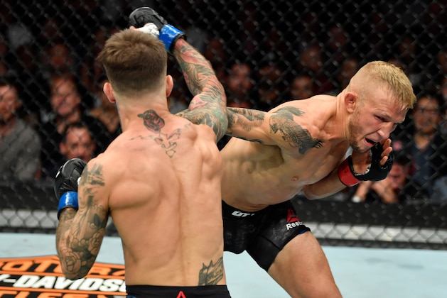 LOS ANGELES, CA - AUGUST 04:  (R-L) TJ Dillashaw punches Cody Garbrandt in their UFC bantamweight championship fight during the UFC 227 event inside Staples Center on August 4, 2018 in Los Angeles, California. (Photo by Jeff Bottari/Zuffa LLC/Zuffa LLC via Getty Images)