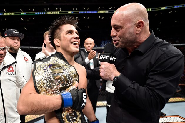 LOS ANGELES, CA - AUGUST 04:  Henry Cejudo is interviewed by Joe Rogan after his split-decision victory over Demetrious Johnson in their UFC flyweight championship fight during the UFC 227 event inside Staples Center on August 4, 2018 in Los Angeles, California. (Photo by Jeff Bottari/Zuffa LLC/Zuffa LLC via Getty Images)