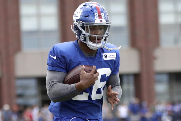 New York Giants running back Saquon Barkley works out during NFL football training camp, Thursday, July 26, 2018, in East Rutherford, N.J. (AP Photo/Julio Cortez)