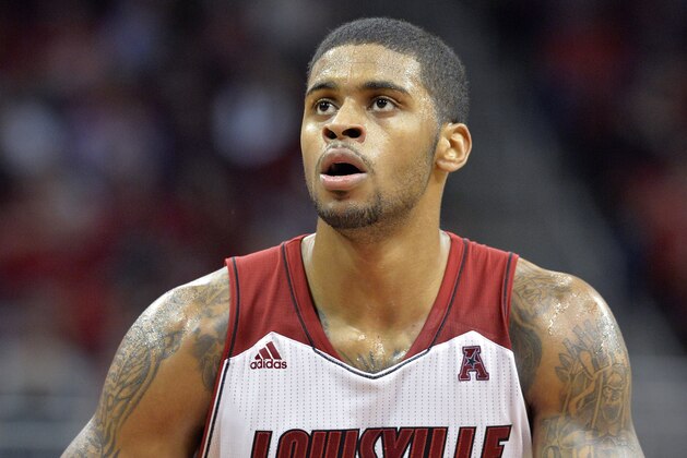 Louisville's Chane Behanan prepares to attempt a free throw during the second half of an NCAA college basketball game Wednesday Dec. 4, 2013, in Louisville, Ky. Louisville defeated UMKC 90-62. (AP Photo/Timothy D. Easley)