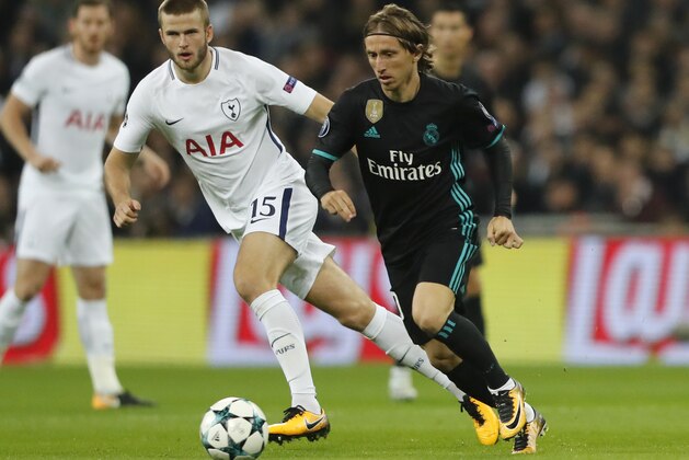 Tottenham's Eric Dier, left, and Real Madrid's Luka Modric challenge for the ball during the soccer Champions League group H match between Tottenham and Real Madrid in London, Wednesday, Nov. 1, 2017. (AP Photo/Frank Augstein)