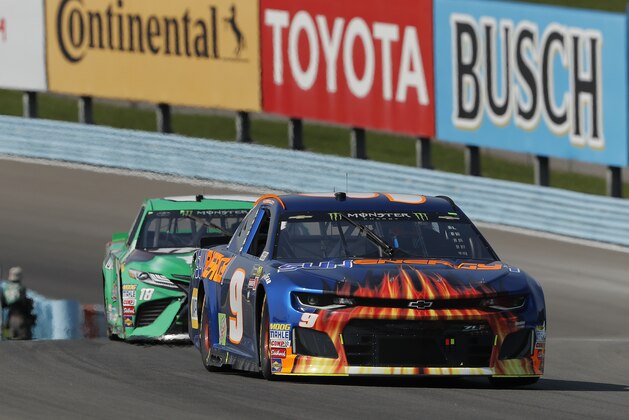 Chase Elliott (9) leads Kyle Busch (18) during a NASCAR Cup series auto race, Sunday, Aug. 5, 2018, in Watkins Glen, N.Y. (AP Photo/Julie Jacobson)