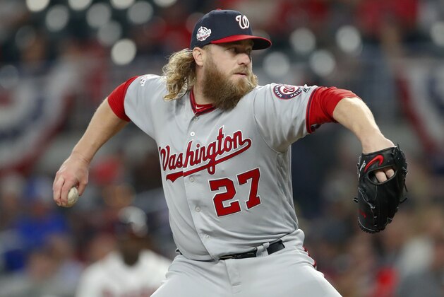 Washington Nationals relief pitcher Shawn Kelley (27) works in the eighth inning of a baseball game against the Atlanta Braves Monday, April 2, 2018, in Atlanta. Washington won 8-1. (AP Photo/John Bazemore)