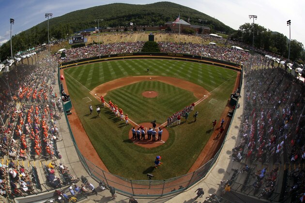 Japan and Texas line the baselines at Lamade Stadium during introductions before the Little League World Series Championship baseball game in South Williamsport, Pa., Sunday, Aug. 27, 2017. (AP Photo/Gene J. Puskar).