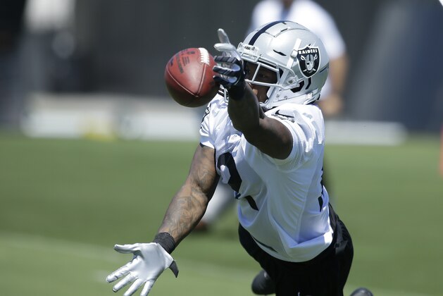 Oakland Raiders wide receiver Martavis Bryant leaps for a pass at the NFL football team's minicamp Wednesday, June 13, 2018, in Alameda, Calif. (AP Photo/Rich Pedroncelli)