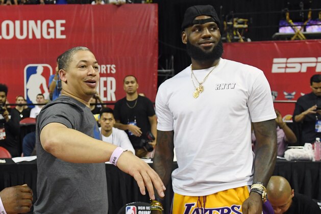 LAS VEGAS, NV - JULY 15:  Head coach Tyronn Lue (L) of the Cleveland Cavaliers talks with LeBron James of the Los Angeles Lakers after a quarterfinal game of the 2018 NBA Summer League between the Lakers and the Detroit Pistons at the Thomas & Mack Center on July 15, 2018 in Las Vegas, Nevada. NOTE TO USER: User expressly acknowledges and agrees that, by downloading and or using this photograph, User is consenting to the terms and conditions of the Getty Images License Agreement.  (Photo by Ethan Miller/Getty Images)