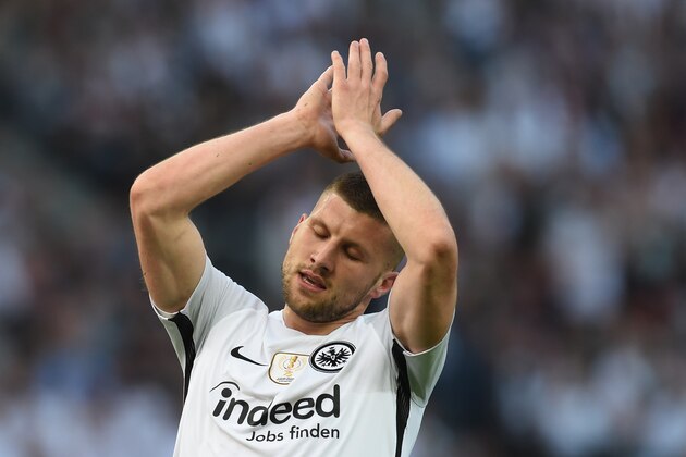 Frankfurt's Croatian forward Ante Rebic celebrates scoring  the opening goal during the German Cup DFB Pokal final football match FC Bayern Munich vs Eintracht Frankfurt at the Olympic Stadium in Berlin on May 19, 2018. (Photo by Christof STACHE / AFP) / RESTRICTIONS: ACCORDING TO DFB RULES IMAGE SEQUENCES TO SIMULATE VIDEO IS NOT ALLOWED DURING MATCH TIME. MOBILE (MMS) USE IS NOT ALLOWED DURING AND FOR FURTHER TWO HOURS AFTER THE MATCH. == RESTRICTED TO EDITORIAL USE == FOR MORE INFORMATION CONTACT DFB DIRECTLY AT +49 69 67880 /         (Photo credit should read CHRISTOF STACHE/AFP/Getty Images)