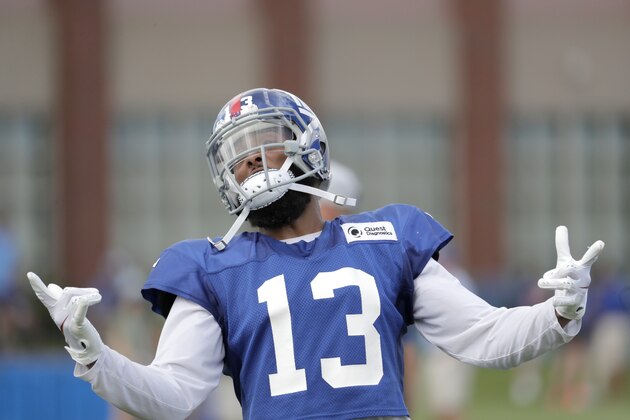 New York Giants wide receiver Odell Beckham gestures toward fans during NFL football training camp, Thursday, Aug. 2, 2018, in East Rutherford, N.J. (AP Photo/Julio Cortez)