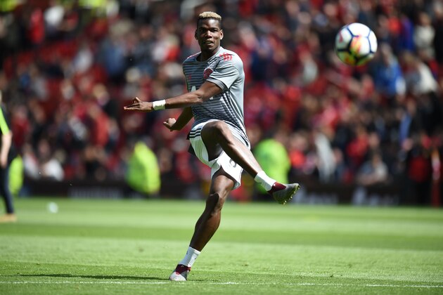 Manchester United's French midfielder Paul Pogba warms up for the English Premier League football match between Manchester United and Watford at Old Trafford in Manchester, north west England, on May 13, 2018. (Photo by Oli SCARFF / AFP) / RESTRICTED TO EDITORIAL USE. No use with unauthorized audio, video, data, fixture lists, club/league logos or 'live' services. Online in-match use limited to 75 images, no video emulation. No use in betting, games or single club/league/player publications. /         (Photo credit should read OLI SCARFF/AFP/Getty Images)