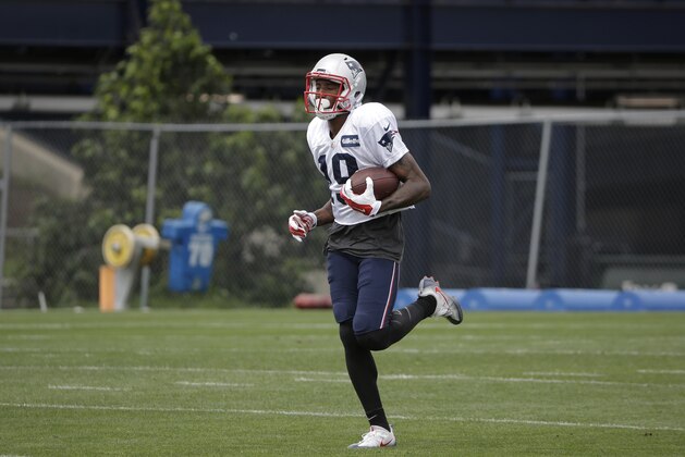 New England Patriots wide receiver Malcolm Mitchell runs with the ball during an NFL football practice, Tuesday, Aug. 29, 2017, in Foxborough, Mass. (AP Photo/Steven Senne)