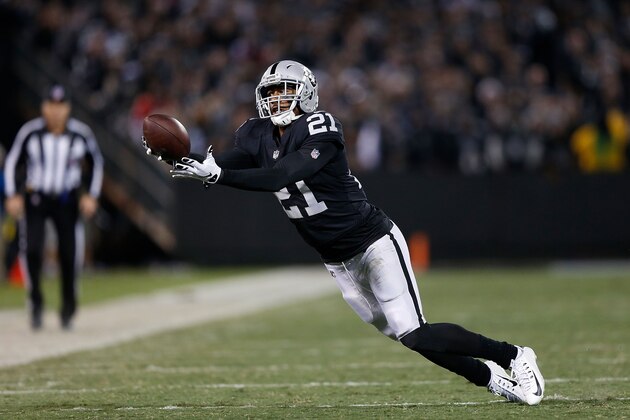 OAKLAND, CA - DECEMBER 17: Sean Smith #21 of the Oakland Raiders intercepts a pass by Dak Prescott #4 of the Dallas Cowboys at Oakland-Alameda County Coliseum on December 17, 2017 in Oakland, California. (Photo by Lachlan Cunningham/Getty Images)