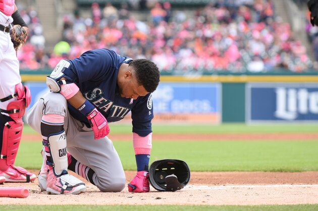 DETROIT, MI - MAY 13:  Robinson Cano #22 of the Seattle Mariners kneels on the ground after getting hit on the right hand by a pitch from Blaine Hardy #36 of the Detroit Tigers during the third inning of the game at Comerica Park on May 13, 2018 in Detroit, Michigan. The Tigers defeated the Mariners 5-4.  (Photo by Mark Cunningham/MLB Photos via Getty Images)