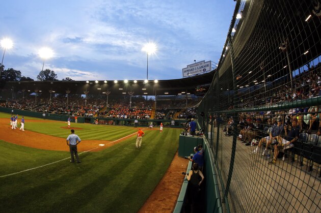 The sunsets on Lamade Stadium during a baseball game between Grosse Pointe, Mich., and Lufkin, Texas in United States pool play at the Little League World Series tournament in South Williamsport, Pa., Thursday, Aug. 17, 2017. (AP Photo/Gene J. Puskar)