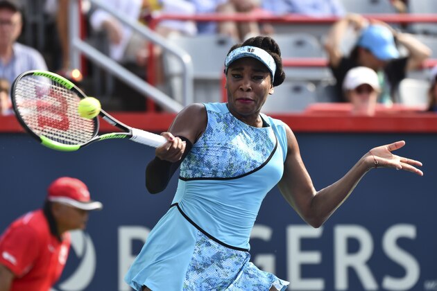 MONTREAL, QC - AUGUST 06:  Venus Williams hits a return against Caroline Dolehide during day one of the Rogers Cup at IGA Stadium on August 6, 2018 in Montreal, Quebec, Canada.  (Photo by Minas Panagiotakis/Getty Images)