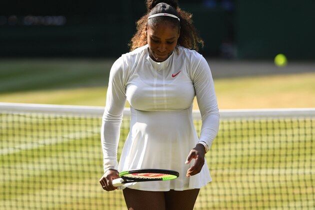 US player Serena Williams reacts while playing Germany's Angelique Kerber during their women's singles final match on the twelfth day of the 2018 Wimbledon Championships at The All England Lawn Tennis Club in Wimbledon, southwest London, on July 14, 2018. (Photo by Glyn KIRK / AFP) / RESTRICTED TO EDITORIAL USE        (Photo credit should read GLYN KIRK/AFP/Getty Images)