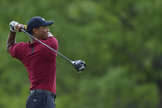 Tiger Woods watches his tee shot on the sixth hole during the final round of the Bridgestone Invitational golf tournament at Firestone Country Club, Sunday, Aug. 5, 2018, in Akron, Ohio. (AP Photo/David Dermer)