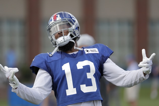 New York Giants wide receiver Odell Beckham gestures toward fans during NFL football training camp, Thursday, Aug. 2, 2018, in East Rutherford, N.J. (AP Photo/Julio Cortez)