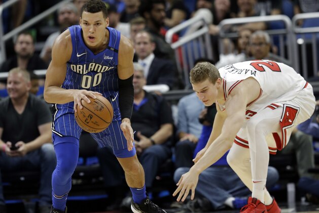 Orlando Magic's Aaron Gordon (00) moves the ball after he a steal from Chicago Bulls' Lauri Markkanen, right, during the second half of an NBA basketball game, Friday, Nov. 3, 2017, in Orlando, Fla. Chicago won 105-83. (AP Photo/John Raoux)