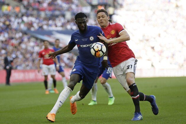 Chelsea's Tiemoue Bakayoko fights for the ball with Manchester United's Nemanja Matic, right, during the English FA Cup final soccer match between Chelsea and Manchester United at Wembley stadium in London, Saturday, May 19, 2018. (AP Photo/Tim Ireland)