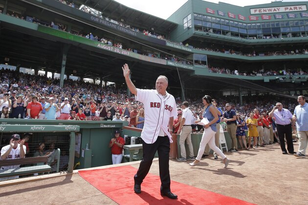 Boston Red Sox broadcaster Jerry Remy waves as he is honored for his 30 years in the broadcast booth at Fenway Park, before a baseball game between the New York Yankees and the Red Sox, Sunday, Aug. 20, 2017, in Boston. Remy was recently diagnosed with cancer for the fifth time. (AP Photo/Steven Senne)