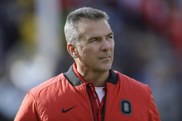 Ohio State head coach Urban Meyer walks on the field during warmups an NCAA college football game against Michigan, Saturday, Nov. 25, 2017, in Ann Arbor, Mich. (AP Photo/Carlos Osorio)