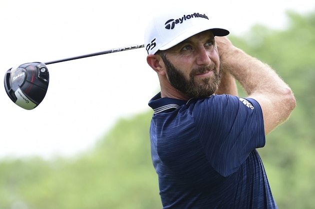 Dustin Johnson watches his tee shot on the 10th hole during the final round of the Bridgestone Invitational golf tournament at Firestone Country Club, Sunday, Aug. 5, 2018, in Akron, Ohio. (AP Photo/David Dermer)