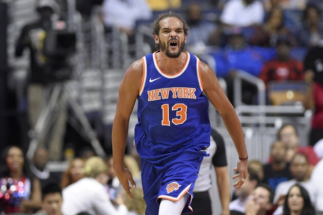 New York Knicks center Joakim Noah (13) reacts during the second half of a preseason NBA basketball game against the Washington Wizards, Friday, Oct. 6, 2017, in Washington. The Wizards won 104-100. (AP Photo/Nick Wass)