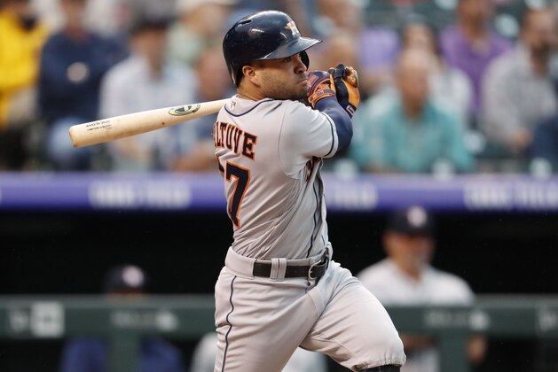 Houston Astros' Jose Altuve watches his RBI-double off Colorado Rockies starting pitcher Jon Gray during the fourth inning of a baseball game Wednesday, July 25, 2018, in Denver. (AP Photo/David Zalubowski)