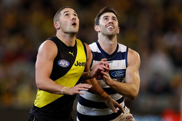 MELBOURNE, AUSTRALIA - AUGUST 03: Debutant, Ryan Abbott of the Cats and Shaun Grigg of the Tigers compete in a ruck contest during the 2018 AFL round 20 match between the Richmond Tigers and the Geelong Cats at the Melbourne Cricket Ground on August 03, 2018 in Melbourne, Australia. (Photo by Adam Trafford/AFL Media/Getty Images)