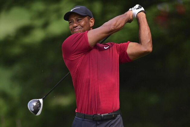 Tiger Woods watches his tee shot on the second hole during the final round of the Bridgestone Invitational golf tournament at Firestone Country Club, Sunday, Aug. 5, 2018, in Akron, Ohio. (AP Photo/David Dermer)