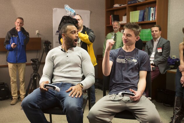 IMAGE DISTRIBUTED FOR CENTURYLINK - CenturyLink and Seattle Seahawks wide receiver Doug Baldwin shared a home team connection to deliver a Boostbox to Max Cohen, a 15-year-old patient at Virginia Mason Hospital, and play a game of Madden NFL, Tuesday, Nov. 28, 2017 in Seattle. Cohen, who was born deaf, has powered through several surgeries to regain his sense of hearing thanks to cochlear implants. Fans can win their very own Seahawks Boostbox full of new prizes through the end of the season by visiting seahawks.com/centurylink. (Ron Wurzer/AP Images for CenturyLink)