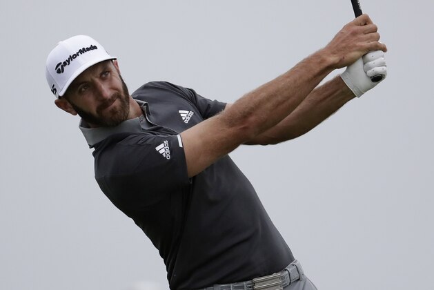 Dustin Johnson plays his shot from the 13th tee during the second round of the U.S. Open Golf Championship, Friday, June 15, 2018, in Southampton, N.Y. (AP Photo/Julio Cortez)