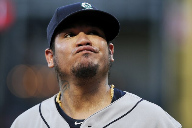 Seattle Mariners starting pitcher Felix Hernandez reacts after allowing a soft bunt-single by Texas Rangers' Carlos Tocci during the third inning of a baseball game Tuesday, Aug. 7, 2018, in Arlington, Texas. The Rangers won 11-4. (AP Photo/Brandon Wade)