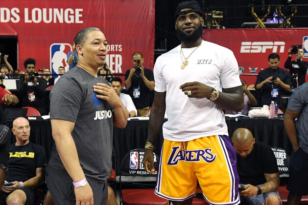 LAS VEGAS, NV - JULY 15:  Head coach Tyronn Lue (L) of the Cleveland Cavaliers talks with LeBron James of the Los Angeles Lakers after a quarterfinal game of the 2018 NBA Summer League between the Lakers and the Detroit Pistons at the Thomas & Mack Center on July 15, 2018 in Las Vegas, Nevada. NOTE TO USER: User expressly acknowledges and agrees that, by downloading and or using this photograph, User is consenting to the terms and conditions of the Getty Images License Agreement.  (Photo by Ethan Miller/Getty Images)