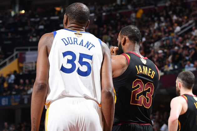 CLEVELAND, OH - JUNE 8: LeBron James #23 of the Cleveland Cavaliers and Kevin Durant #35 of the Golden State Warriors looks on during Game Four of the 2018 NBA Finals on June 8, 2018 at Quicken Loans Arena in Cleveland, Ohio. NOTE TO USER: User expressly acknowledges and agrees that, by downloading and or using this Photograph, user is consenting to the terms and conditions of the Getty Images License Agreement. Mandatory Copyright Notice: Copyright 2018 NBAE (Photo by Andrew D. Bernstein/NBAE via Getty Images)