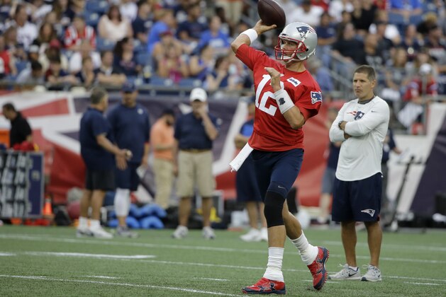 New England Patriots quarterback Tom Brady (12) winds up for a pass during an NFL football practice, Monday, July 30, 2018, at Gillette Stadium, in Foxborough, Mass. (AP Photo/Steven Senne)