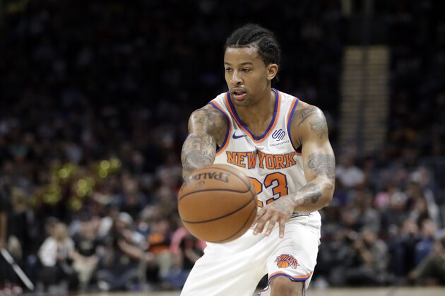 New York Knicks' Trey Burke passes against the Cleveland Cavaliers in the second half of an NBA basketball game, Wednesday, April 11, 2018, in Cleveland. (AP Photo/Tony Dejak)