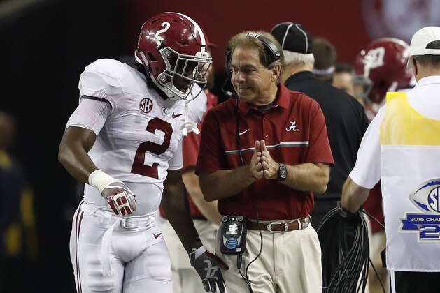 FILE - In this Dec. 3, 2016, file photo, Alabama quarterback Jalen Hurts (2) speaks with Alabama head coach Nick Saban during the second half of the Southeastern Conference championship NCAA college football game against Florida, in Atlanta. Top-ranked Alabama's freshman quarterback has shown poise beyond his years under the pressure of leading the Crimson Tide to a Southeastern Conference title and playoff berth.  (AP Photo/John Bazemore, File)