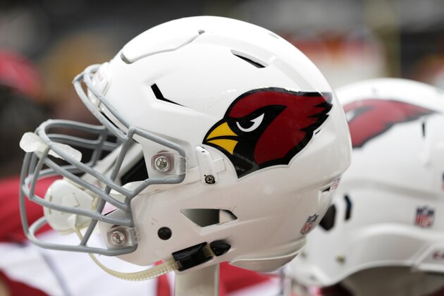 An Arizona Cardinals helmet sits on the bench during an NFL football game between the Arizona Cardinals and Washington Redskins, Sunday, Dec. 17, 2017, in Landover, Md. (AP Photo/Mark Tenally)