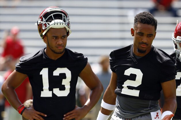 Alabama quarterback Jalen Hurts (2) and quarterback Tua Tagovailoa (13) runs drills during a NCAA college football practice, Saturday, Aug. 4, 2018, in Tuscaloosa, Ala. (AP Photo/Butch Dill)