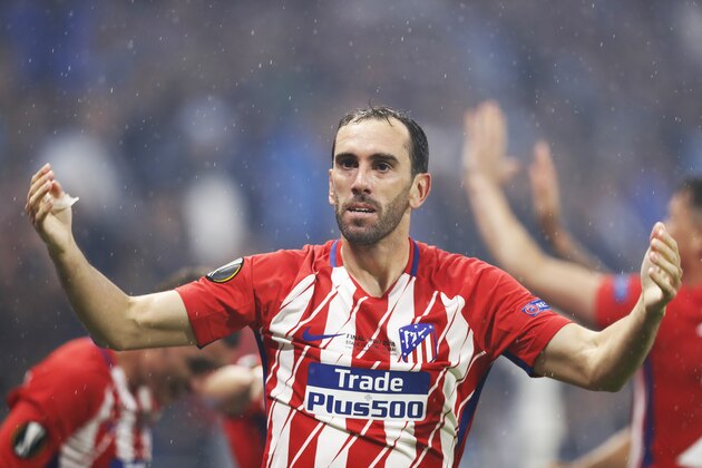 LYON, FRANCE - MAY 16: Diego Godin of Athletico Madrid celebrates after Antoine Griezmann of Athletico Madrid scores his second goal during the UEFA Europa League Final between Olympique de Marseille and Club Atletico de Madrid at Stade de Lyon on May 16, 2018 in Lyon, France. (Photo by Ian MacNicol/Getty Images)