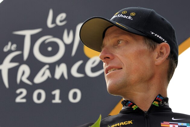 FILE- In this  July 25, 2010, file photo, Lance Armstrong, of the United States, looks back on the podium after the 20th and last stage of the Tour de France cycling race in Paris. Armstrong’s $100 million civil fraud trial is months away, yet his fight with the government and former teammate-turned-rival Floyd Landis is heating up. The trial is scheduled for November in federal court in Washington D.C., and lawyers for both sides recently filed a series of motions asking U.S. District Judge Christopher Cooper to exclude some key evidence. (AP Photo/Bas Czerwinski, File)