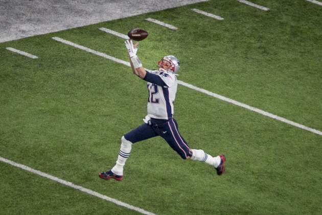 New England Patriots quarterback Tom Brady tries and fails to make a catch against the Philadelphia Eagles in the second quarter of the NFL Super Bowl 52 football game Sunday, Feb. 4, 2018, in Minneapolis. (AP Photo/Bruce Kluckhohn)