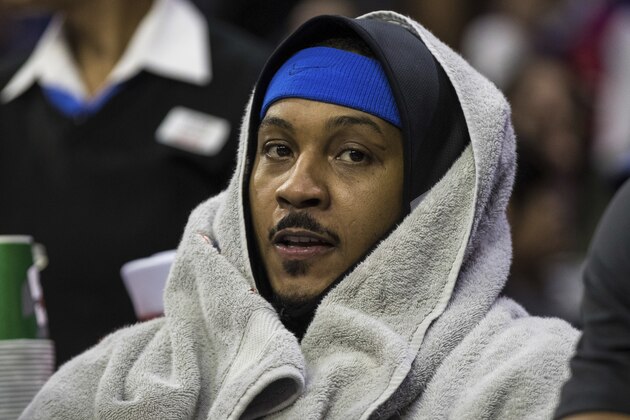 Oklahoma City Thunder's Carmelo Anthony looks on from the bench during the second half of an NBA basketball game against the Philadelphia 76ers, Friday, Dec. 15, 2017, in Philadelphia. The Thunder won 119-117 in triple overtime. (AP Photo/Chris Szagola)
