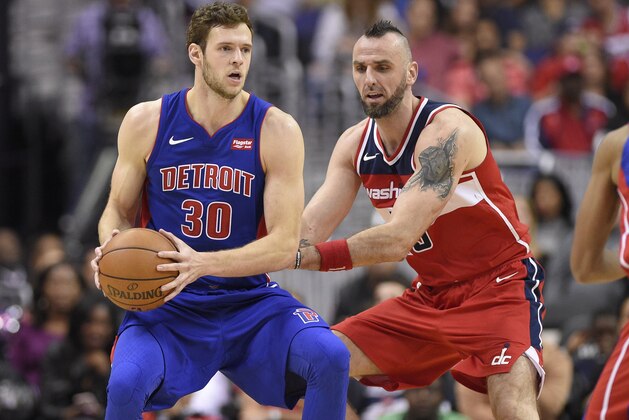 Detroit Pistons forward Jon Leuer (30) holds the ball against Washington Wizards center Marcin Gortat, right, of Poland, during the second half of an NBA basketball game, Friday, Oct. 20, 2017, in Washington. The Wizards won 115-111.(AP Photo/Nick Wass)